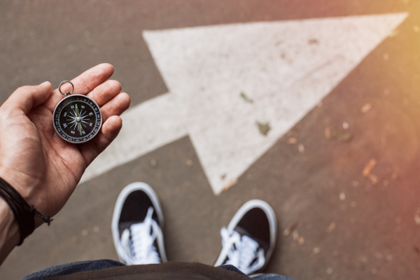 person holding compass